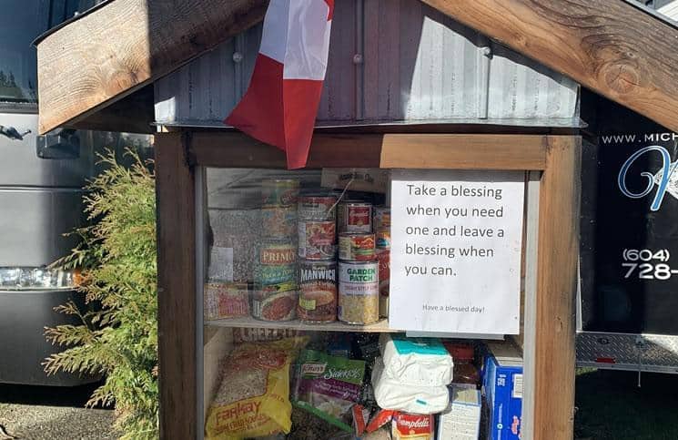 Langley Realtors Michelle Perrault and Cody Lew build food shelter for those in need
