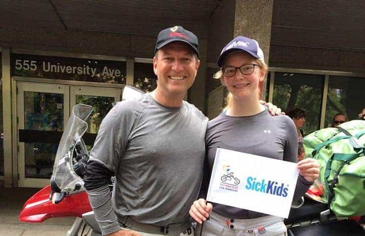 Sales rep Bruce Johnson and daughter riding motorcycle from Arctic to Argentina for children’s hospitals