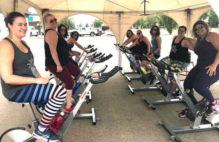 Sales rep Ramie Browatzke hosts Spin-a-Thon for Shelter, raises $20,000